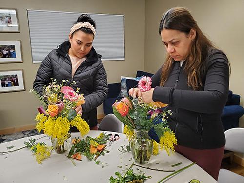 2024 Floral Class, ladies working on and showing their beautiful floral arrangements.